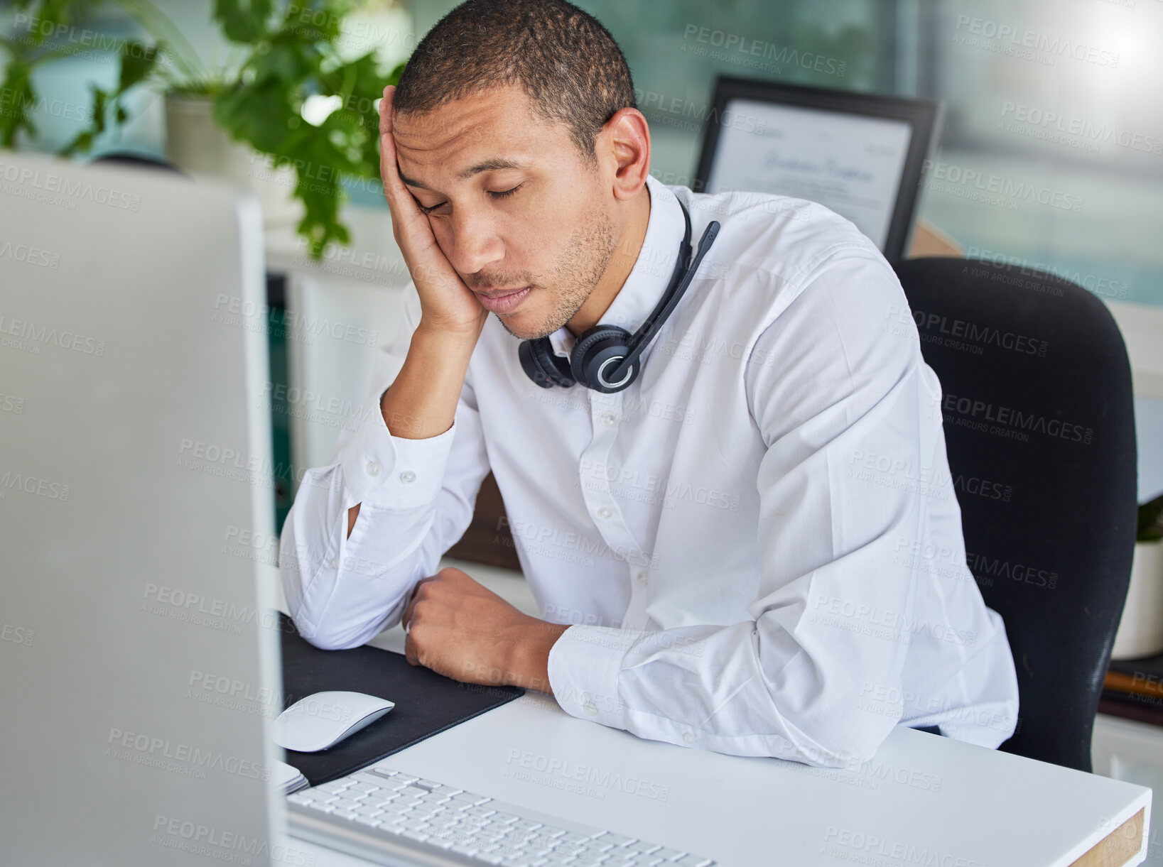 Buy stock photo Burnout, call center or tired agent sleeping at desk from overworked by deadlines or stress. Customer support, black man or lazy telemarketing consultant at computer exhausted, fatigue or resting 