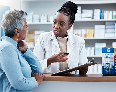 Buy stock photo Pharmacy, medical or insurance with a customer and black woman pharmacist in a dispensary. Healthcare, clipboard and trust with a female medicine professional helping a patient in a drugstore