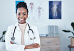 Portrait, happy and black woman doctor proud in hospital, excited and cheerful for healthcare innovation. Face, confident and female health expert smile for medical, mission or ready to help at clinic