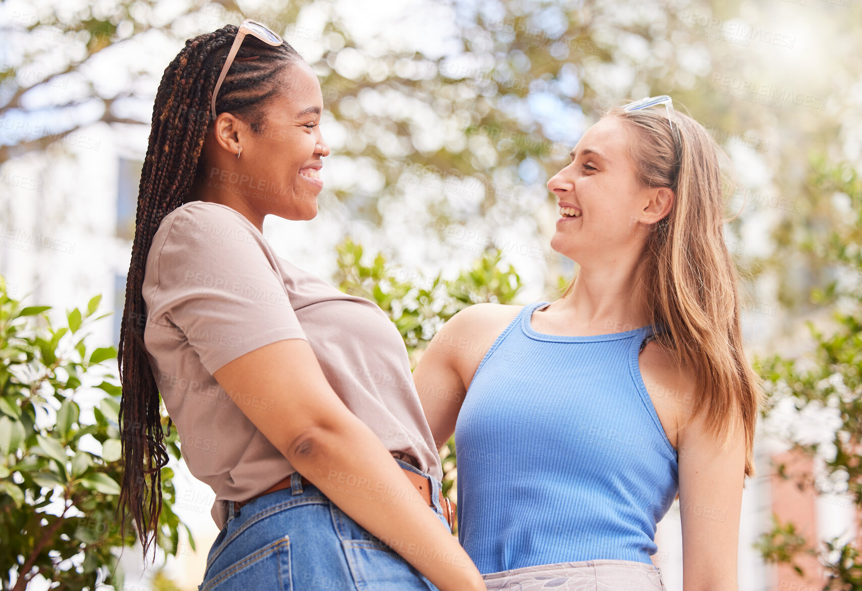 Buy stock photo Summer, diversity and friends happy in the park together, laughing while bonding outdoor in nature. Spring, smile and women in a garden, having fun while enjoying a joke or humor over the weekend