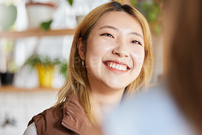 Buy stock photo Face, happy or smile and an asian woman in a coffee shop, enjoying spending time with a friend. Cafe, brunch and lifestyle with an attractive young girl sitting in a restaurant for a chat or catch up