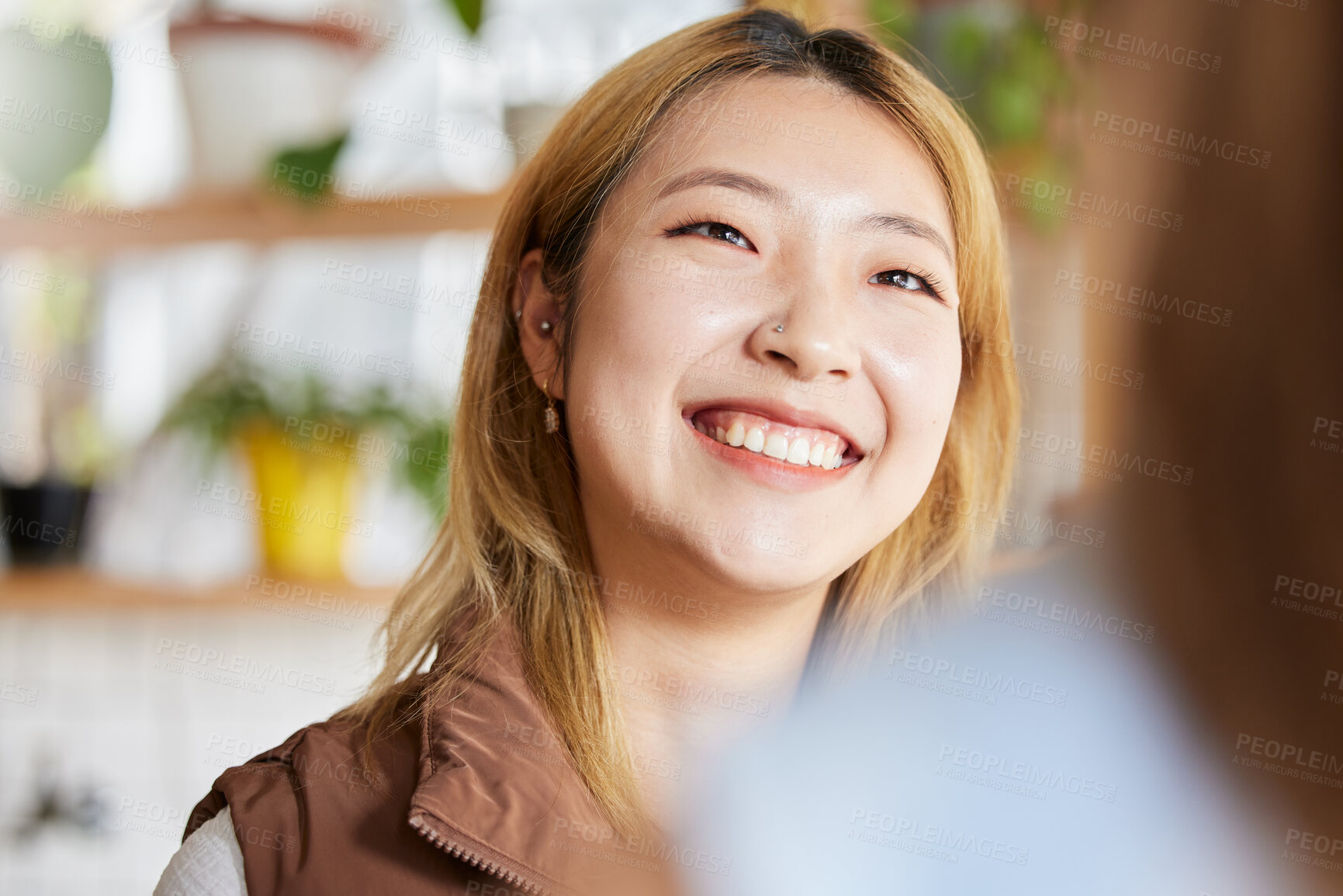 Buy stock photo Face, happy or smile and an asian woman in a coffee shop, enjoying spending time with a friend. Cafe, brunch and lifestyle with an attractive young girl sitting in a restaurant for a chat or catch up