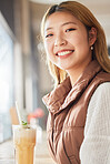 Happy, relax and portrait of a woman with a drink at a cafe for breakfast at a coffee shop. Smile, happiness and beautiful Asian girl with a beverage at a restaurant for enjoyment and relaxation