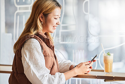 Buy stock photo Phone, happy or woman on social media in cafe with smile on holiday vacation or weekend alone. Networking, Asian person or young girl texting or typing a message in restaurant drinking a cocktail 