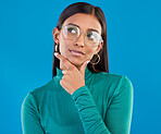 Mockup, Indian woman and thinking with decision, future and fantasy with girl against a blue studio background. Female, lady and imagination with opportunity, choice and ideas with wonder and eyewear