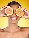 Skincare, beauty and portrait of Indian woman with orange slice and facial detox with smile on yellow background. Health, wellness and model face with organic luxury cleaning and grooming cosmetics.