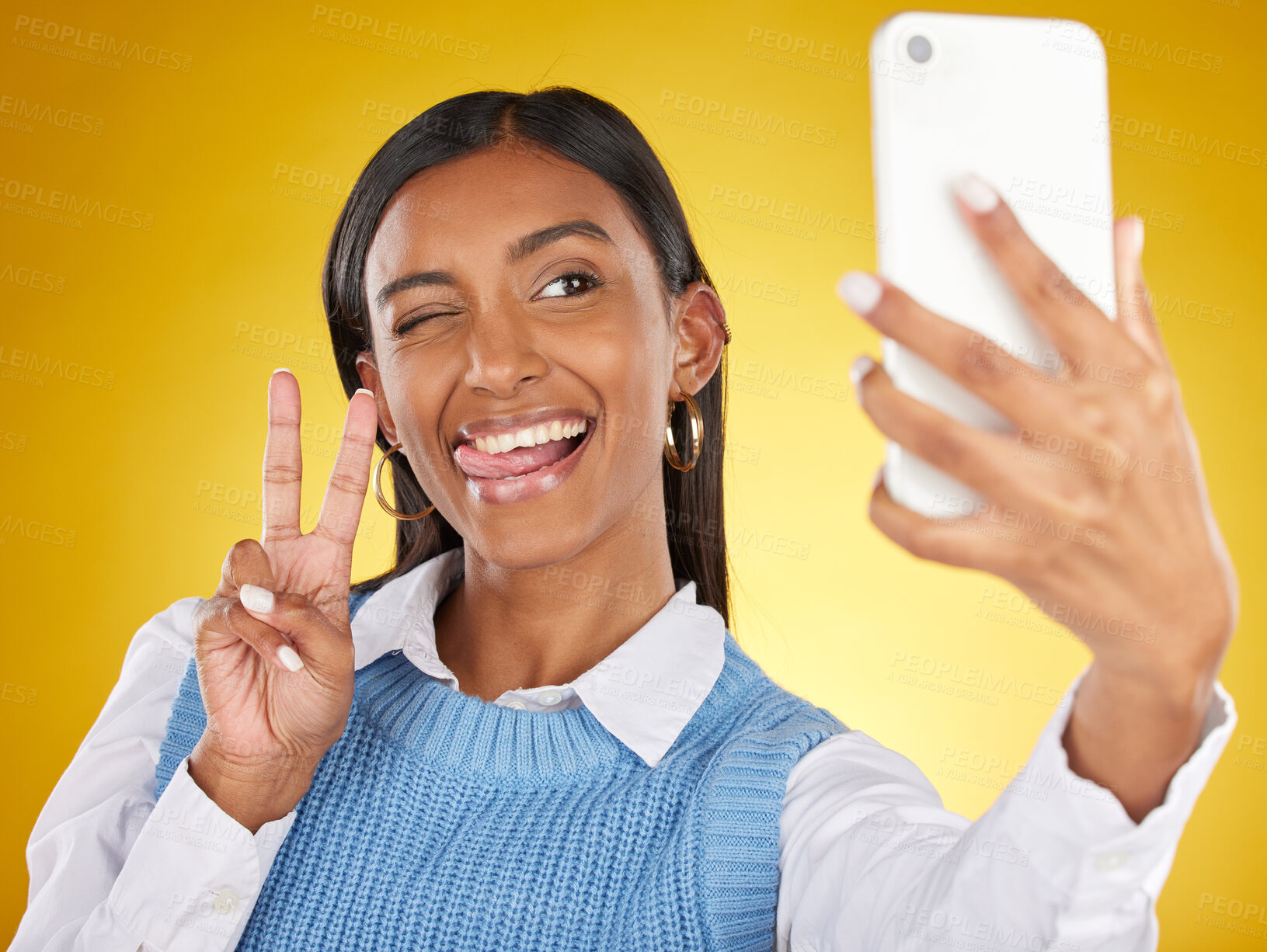 Buy stock photo Selfie, face and peace with a woman in studio on a yellow background to post a profile picture update. Phone, social media and hand gesture with an attractive young female posing for a photograph