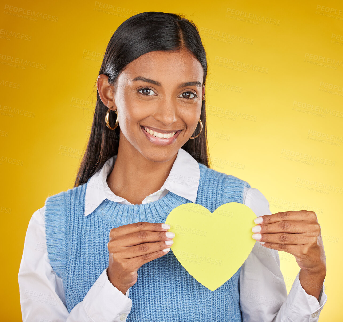 Buy stock photo Portrait, heart cutout and smile of black woman in studio isolated on a yellow background. Face, love emoji and female with symbol, sign or gesture for romance, affection and care on valentines day.