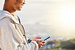 Fitness man, hands and phone on mockup in social media, chatting or texting for travel, journey or trip in nature. Hand of male typing on smartphone with 5G connection for GPS in the outdoors