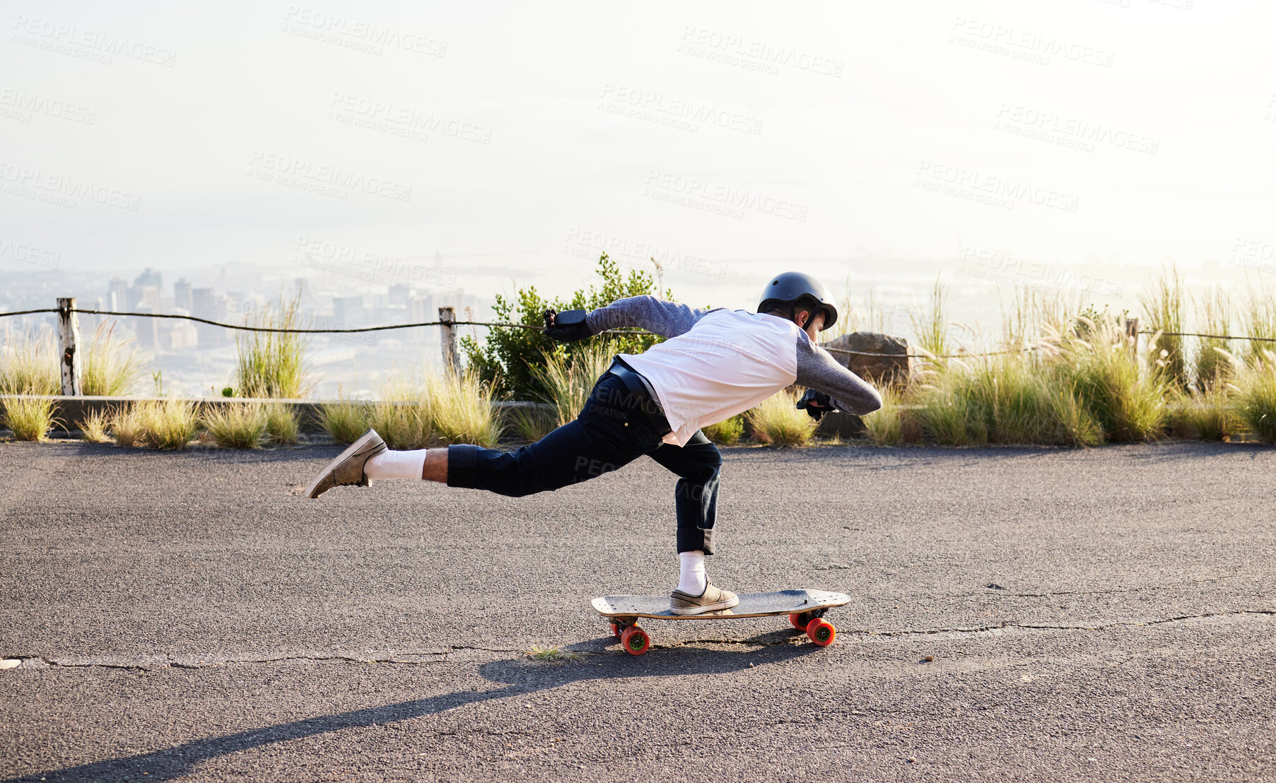 Buy stock photo Skateboard, moving and man in road for sports competition, training and exercise in urban city. Skating, skateboarding and male skater in action for speed, adventure and freedom for extreme sport