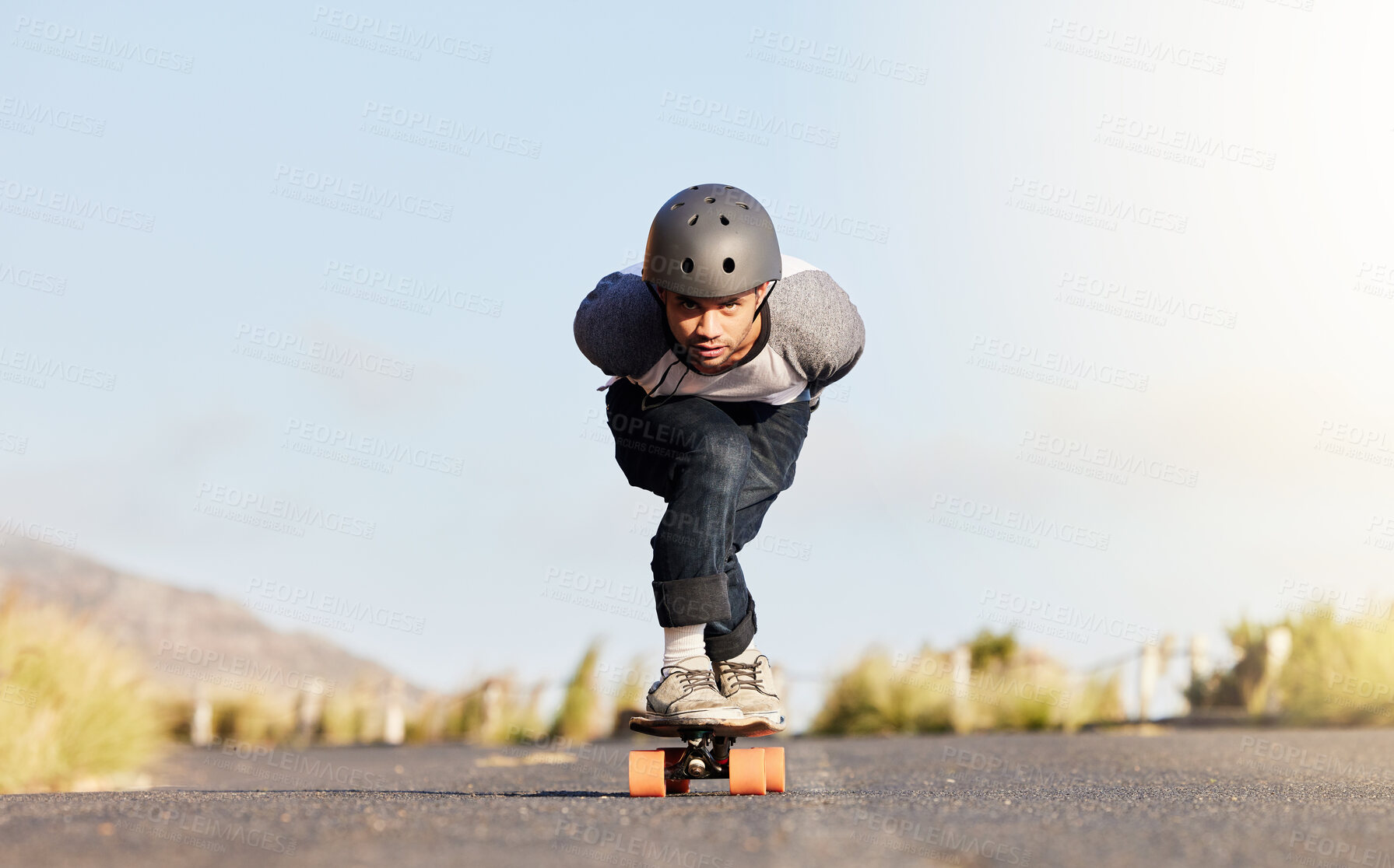 Buy stock photo Skateboard, balance and mountain with man in road for speed, freedom and summer break. Sports, adventure and wellness with guy skating fast in street for training, gen z and motion in nature