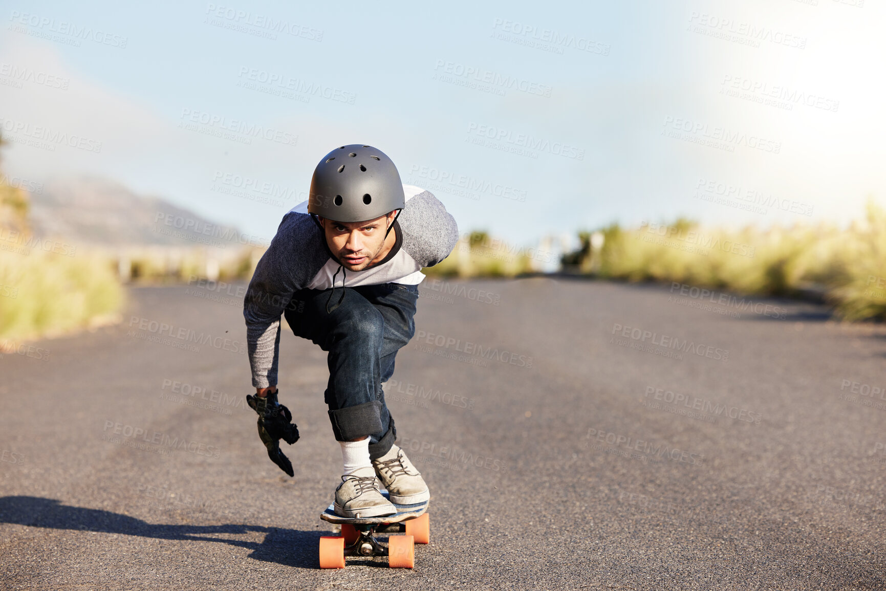 Buy stock photo Skateboard, sports and mountain with man in road and travel for speed, freedom and summer break. Motion, adventure and fitness with guy skating fast in street for training, gen z or balance in nature