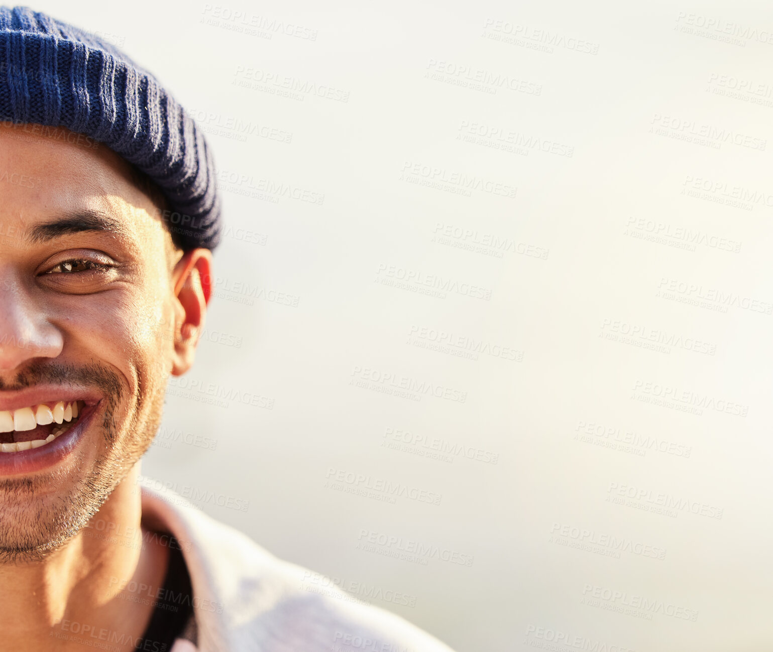 Buy stock photo Half, face and happy man with mockup space by hipster with a fashionable beanie on a simmer day with a smile. Guy, cool and side head of a stylish young male looking confident and excited