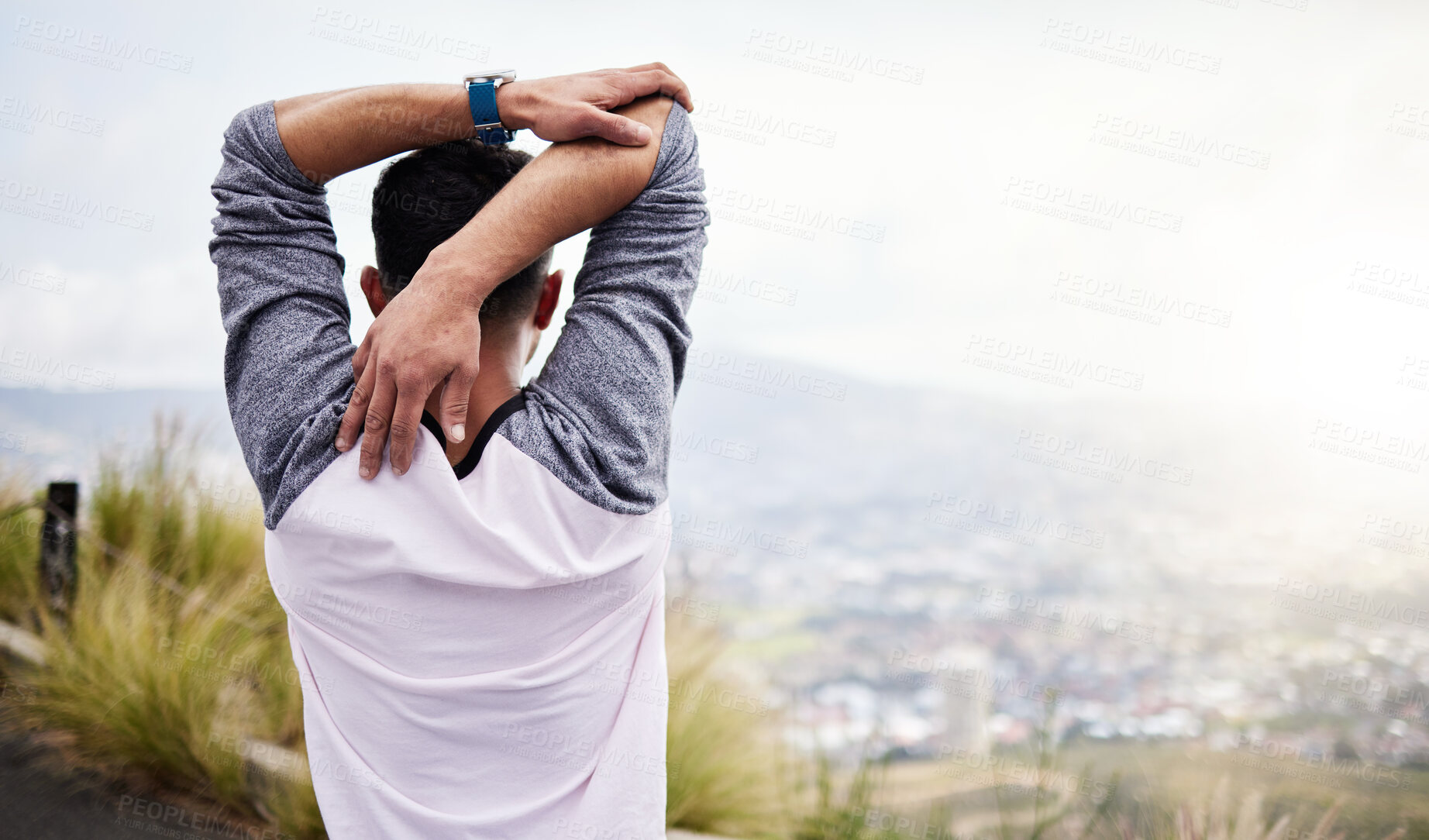 Buy stock photo Man, back and fitness stretching arms on mockup in nature for hiking, travel or outdoor mountain exercise. Rear view of sport male in warm up arm stretch getting ready for trekking journey or workout