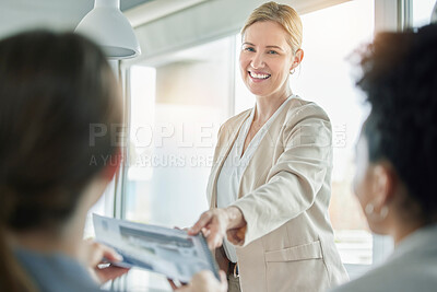 Buy stock photo Woman, business meeting and paperwork for proposal, project and happy with executive agreement. Group, corporate and documents in modern office with b2b partnership deal, paper or negotiation at job