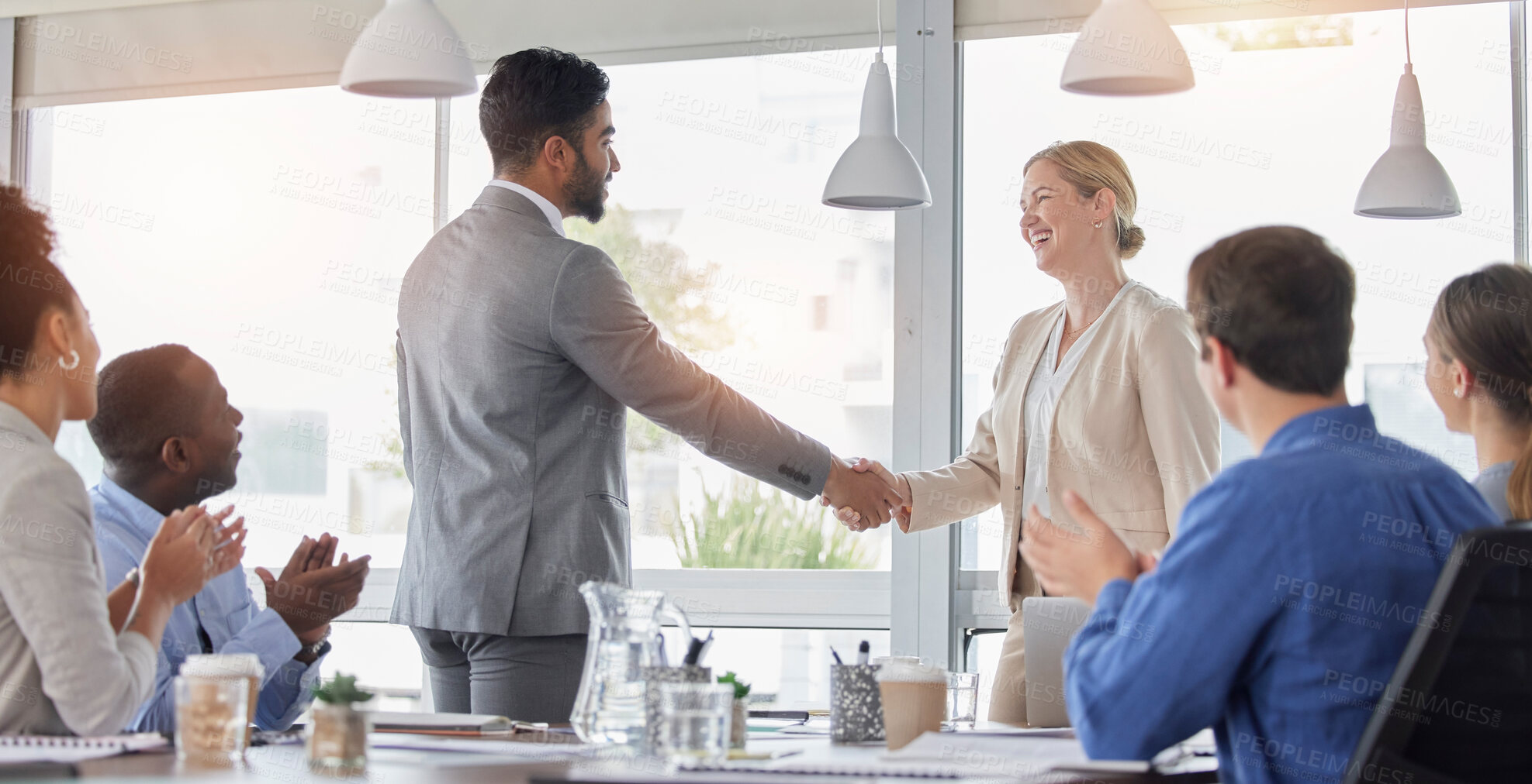 Buy stock photo Business team, handshake and people in meeting for deal, b2b collaboration and congratulations. Man and a woman shaking hands with applause, thank you and corporate partnership achievement in office