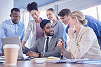 Business people, laptop and team collaboration in meeting, planning or idea strategy at office desk. Group of diverse employee workers sharing ideas in teamwork on computer or project plan at table