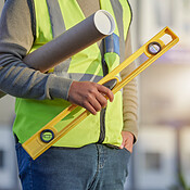 Hands, blueprint ruler and architect man, real estate developer or ...