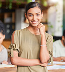 Portrait, mindset and designer with a business woman in the office, standing as a leader with her team in the boardroom. Face, vision and mission with a young female employee looking confident