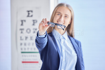 Buy stock photo Optometry, vision and portrait of a woman with glasses with prescription lens after a eye test. Healthcare, eyewear and female patient or customer holding spectacles frame for sight in optical store.