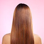 Beauty, hair and back of woman in studio for shampoo, keratin and salon treatment. Health, shine and self care with girl model and growth for glow, textures or cosmetology isolated on pink background