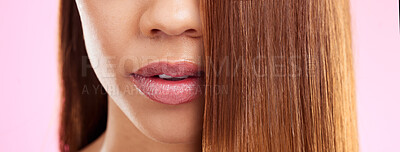 Buy stock photo Beauty, hair and mouth of black woman isolated in studio with pink background for salon advertising. Haircare, straightener and Brazilian hairstyle on model for luxury spa growth product promotion.