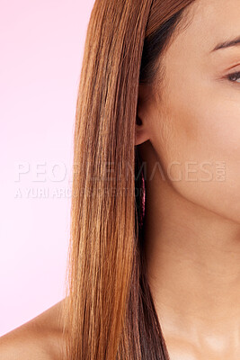 Buy stock photo Zoom, hair and half face of black woman isolated in studio in pink background for beauty salon advertising. Haircare, straightener and Brazilian hairstyle on model for luxury growth product promotion