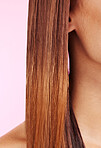 Hair care, brunette and woman with a straight hairstyle isolated on a pink background in a studio. Growth, health and girl with a keratin treatment, smooth and silky style from shampoo on a backdrop