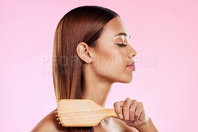 Buy stock photo Woman, brushing hair and hairbrush beauty profile in studio for salon or hairdresser shine shampoo. Haircare of a aesthetic model on a pink background for color, glow or growth cosmetics and grooming