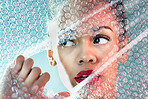 Bubble wrap, beauty and face of woman with makeup, cosmetics and skincare products in studio. Creative art deco, salon aesthetic and thinking girl with glow, lipstick and luxury style with plastic