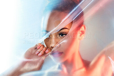 Buy stock photo Plastic tear, makeup and face of woman with beauty products, cosmetics and skincare in studio. Creative art deco, aesthetic and eyes of girl with glow, lipstick and luxury style with neon packaging