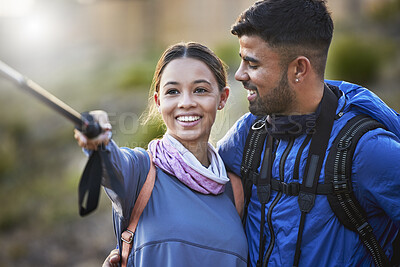Buy stock photo Couple, hiking selfie and backpack together for smile, happiness and adventure for fitness on mountain. Gen z man, woman and outdoor with stick for social media, profile picture or training with love