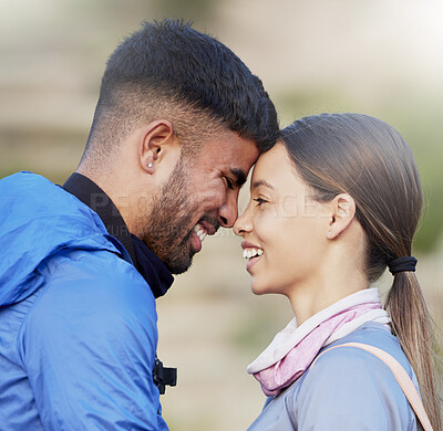 Buy stock photo Man, woman and forehead touch for hiking, love and happiness in nature for outdoor adventure on holiday. Young happy couple, training and smile with care, bonding and vacation in countryside together