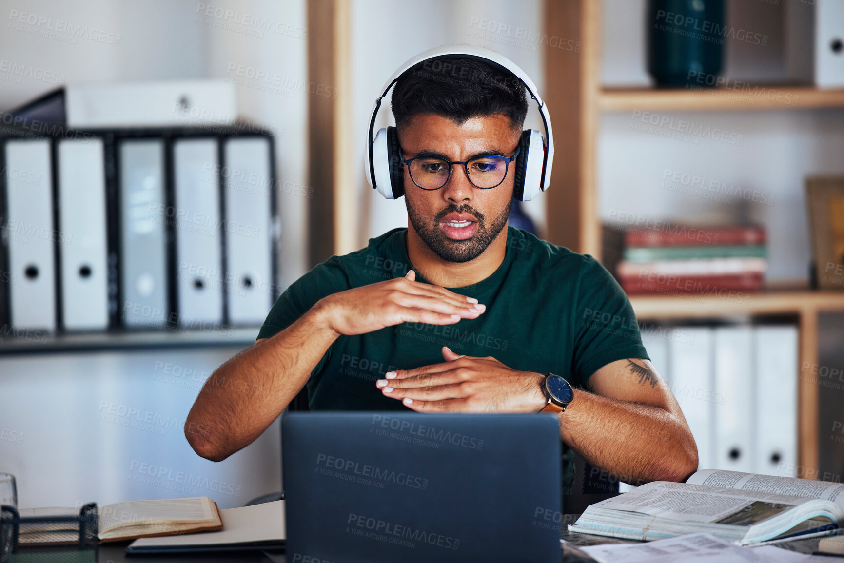 Buy stock photo Man, office and video call with hands, size and explaining for webinar, online workshop or learning. Gen z student guy, studying and books for education with laptop, headphones and digital classroom