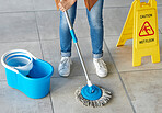 Floor mopping, cleaning sign and mop bucket with water and woman doing safety and hygiene work. Wellness, female worker and maid with disinfection container and tile ground with cleaner and janitor