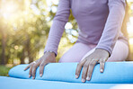 Fitness, woman and hands with yoga mat for spiritual wellness, zen workout or pilates in nature. Hand of female yogi getting ready or preparation for calm or peaceful meditation or exercise at a park