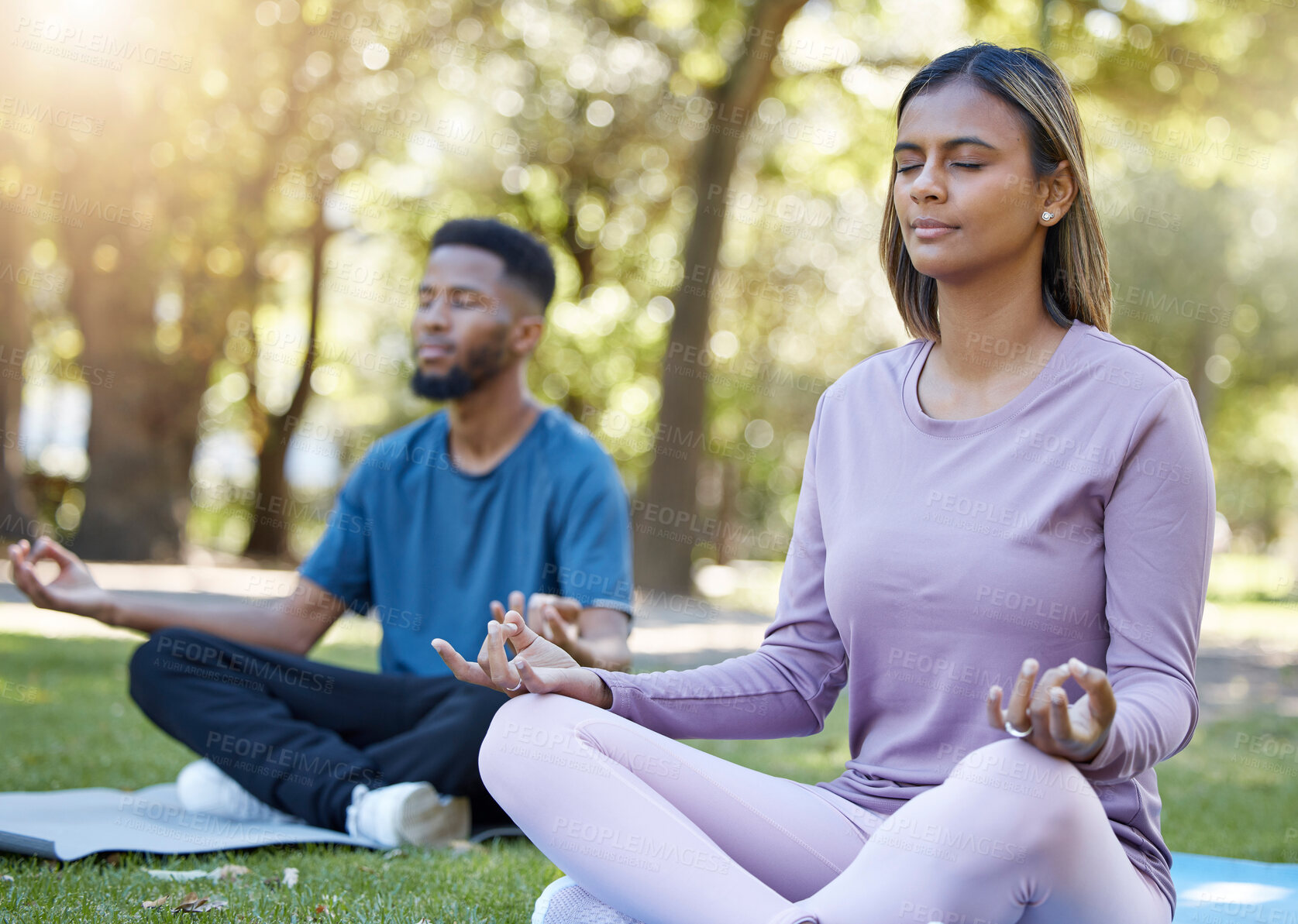 Buy stock photo Mediation, peace and yoga class with people in park for relax, mindfulness and spirituality. Zen, fitness and wellness with black man and woman and training in nature for health, healing or gratitude