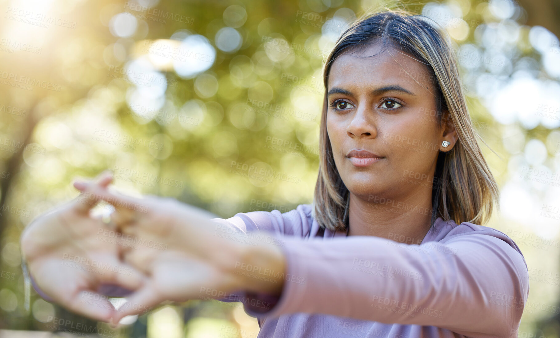 Buy stock photo Fitness, nature and woman doing a stretching exercise before a workout in the park or garden. Sports, wellness and female athlete doing a arm warm up workout before pilates training outdoor in field.