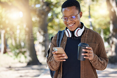 Buy stock photo Social media, park and black man with a phone and coffee for communication, connection and chat. Email, smile and African student reading a notification on a mobile app with a drink on a campus