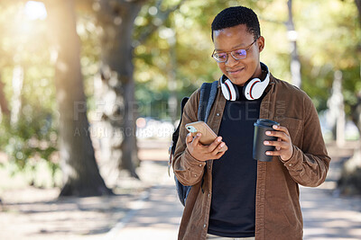 Buy stock photo Black man, phone or coffee on campus, park nature or garden for social media, internet research or class schedule. Smile, happy or student on mobile technology for learning growth with takeaway tea