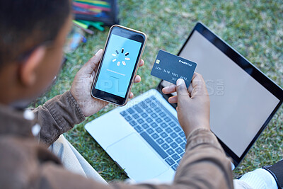 Buy stock photo Credit card, phone banking app and loading on a mobile website payment with laptop mockup screen. Online shopping, ecommerce and 5g connectivity of a customer doing a internet sale outdoor on grass