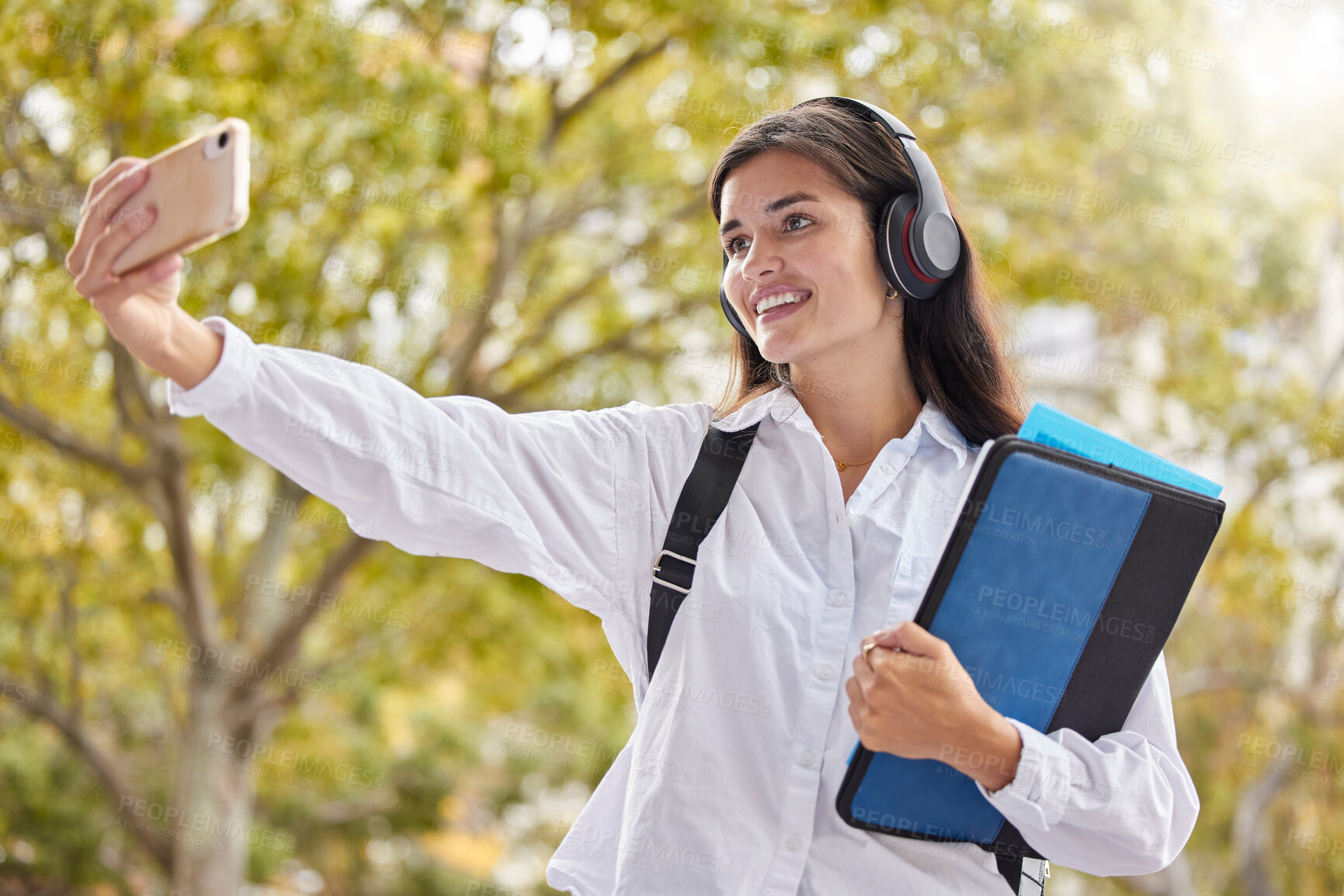 Buy stock photo Student, woman and smile for selfie at university, outdoor and happy for social network ui, web or excited in summer. Young gen z girl, influencer and profile picture at campus with books in sunshine