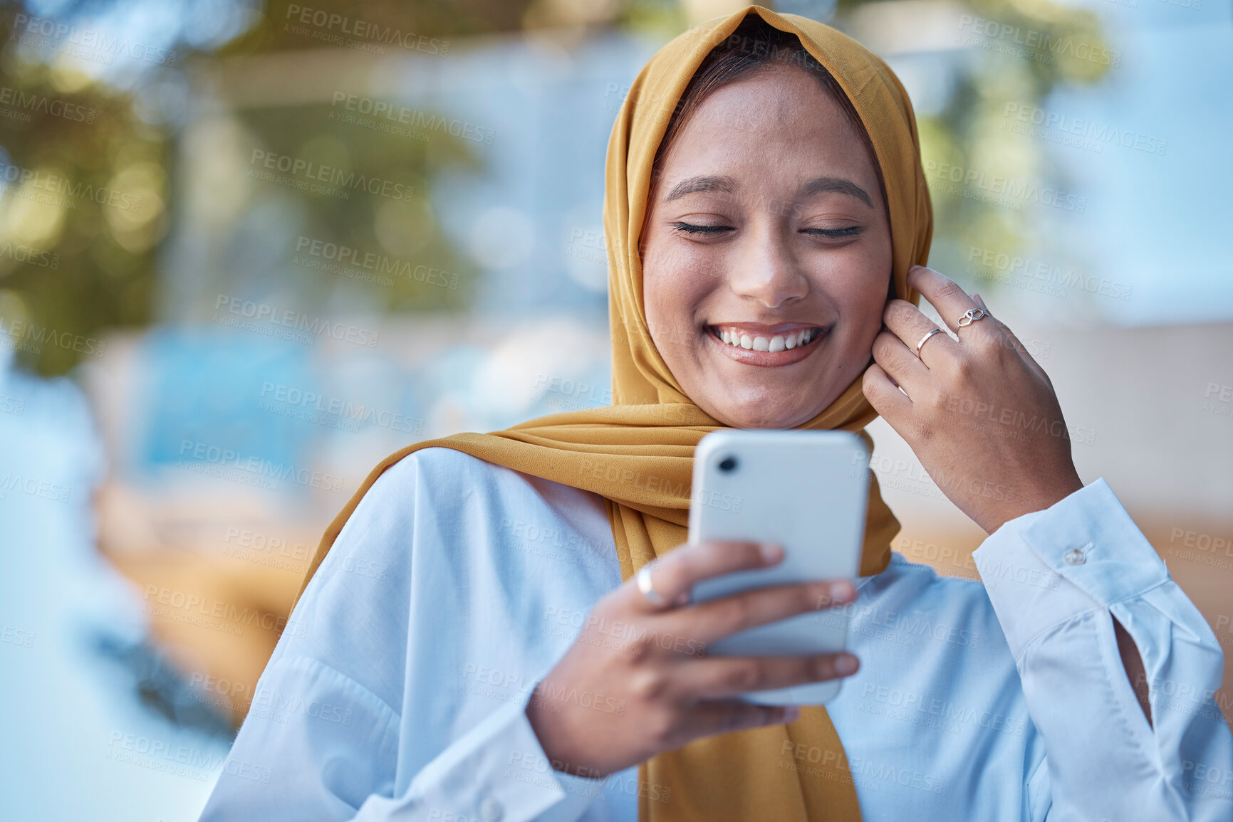 Buy stock photo Muslim woman, phone and happy outdoor for international network, 5g communication and mobile app chat. Young hijab entrepreneur or islamic female from Saudi Arabia typing on cellphone for opportunity