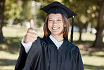 University, graduation and portrait of girl with thumbs up on campus for success, award and certificate ceremony. Education, college and happy female graduate with hand sign for goals and achievement