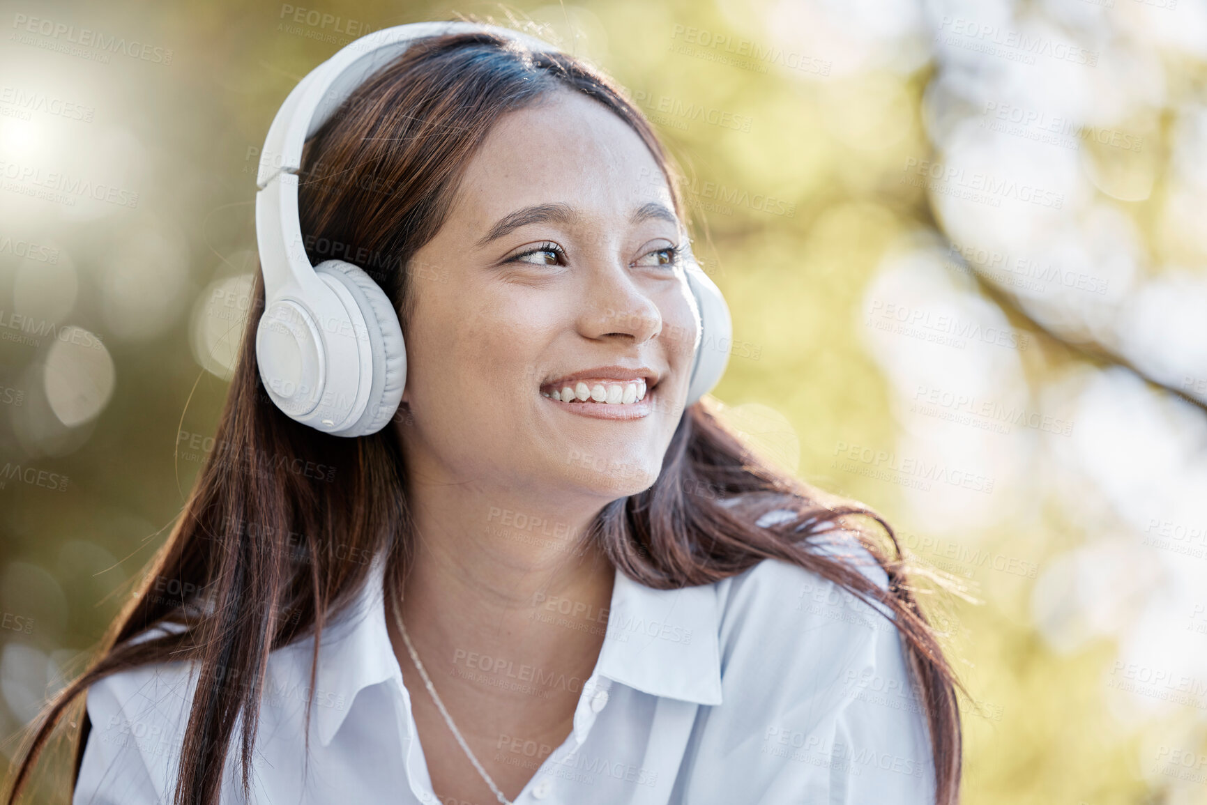 Buy stock photo Headphones, music and woman in nature streaming podcast or radio. Thinking, smile or happy young female with idea, listening or enjoying audio album, song or sound track outdoors in park with headset