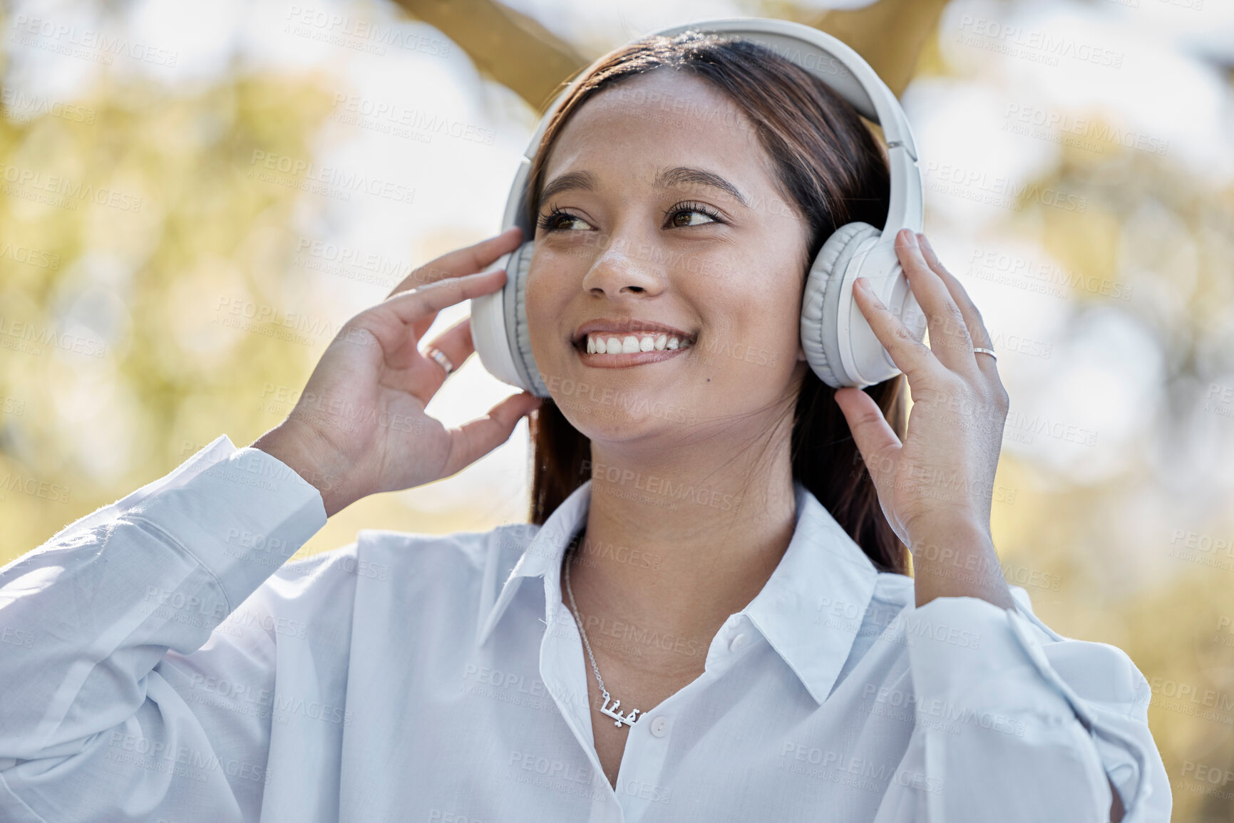 Buy stock photo Music, headphones and business woman in nature streaming podcast or radio. Thinking, smile and happy female entrepreneur listening and enjoying audio album, song and sound track outdoors in park.
