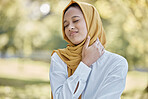 Health, neck pain and Islamic woman outdoor, injury and muscle tension in nature. Muslim female, lady and body ache in park, fatigue and frustrated with inflammation, bruise and first aid problem