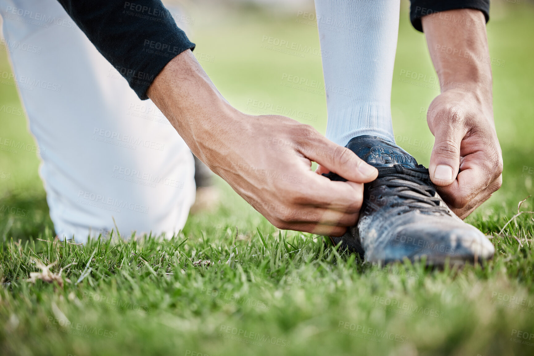 Buy stock photo Closeup, fitness and man tie shoe, hands and exercise for wellness, healthy lifestyle and on field. Zoom, male athlete and player with shoelace, training or workout for balance, sports or competition