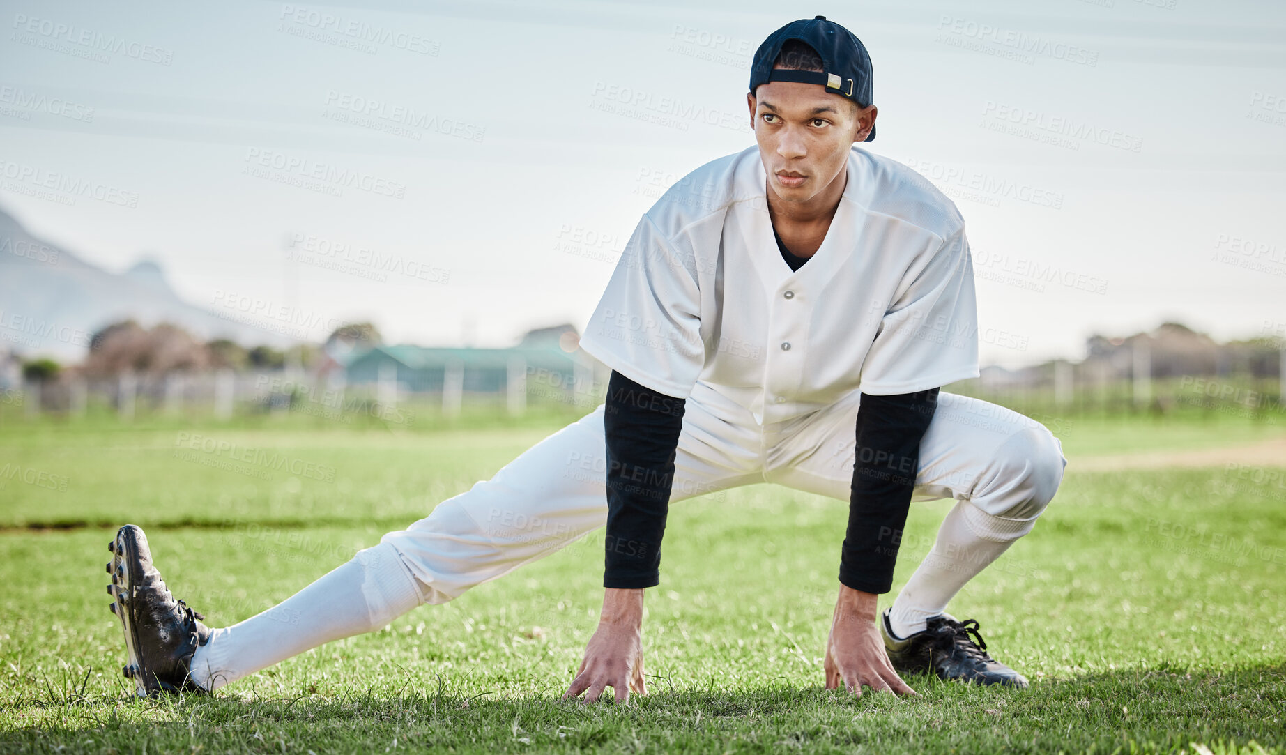 Buy stock photo Baseball, man and stretching on field, fitness and training for match, wellness and healthy lifestyle. Male athlete, player and guy stretch, exercise and practice for competition, park and balance