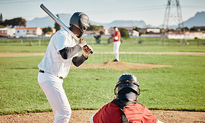Baseball, bat and ready with a sports man outdoor, playing a competitive game during summer. Fitness, health and exercise with a male athlete or player training on a field for sport or recreation